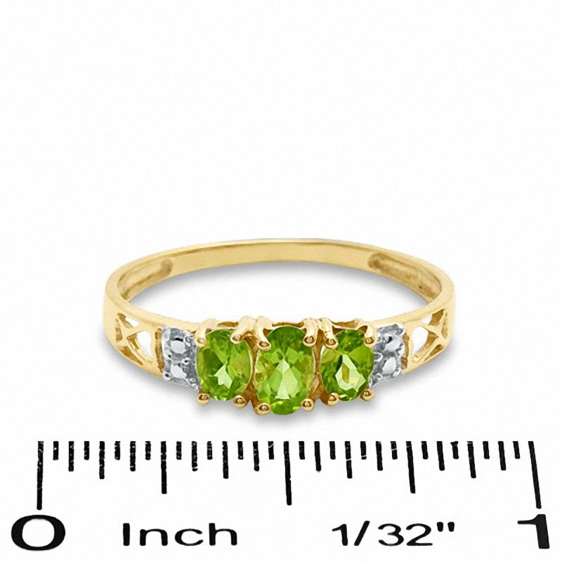 Oval Peridot Three Stone Ring in 10K Gold - Size 7