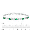 Thumbnail Image 1 of Oval Simulated Emerald and Diamond Accent Infinity Link Bracelet in Sterling Silver - 7.25"