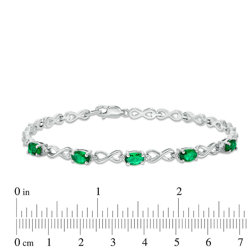 Oval Simulated Emerald and Diamond Accent Infinity Link Bracelet in Sterling Silver - 7.25"