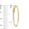 Thumbnail Image 1 of Diamond-Cut Oval Hoop Earrings in 10K Gold